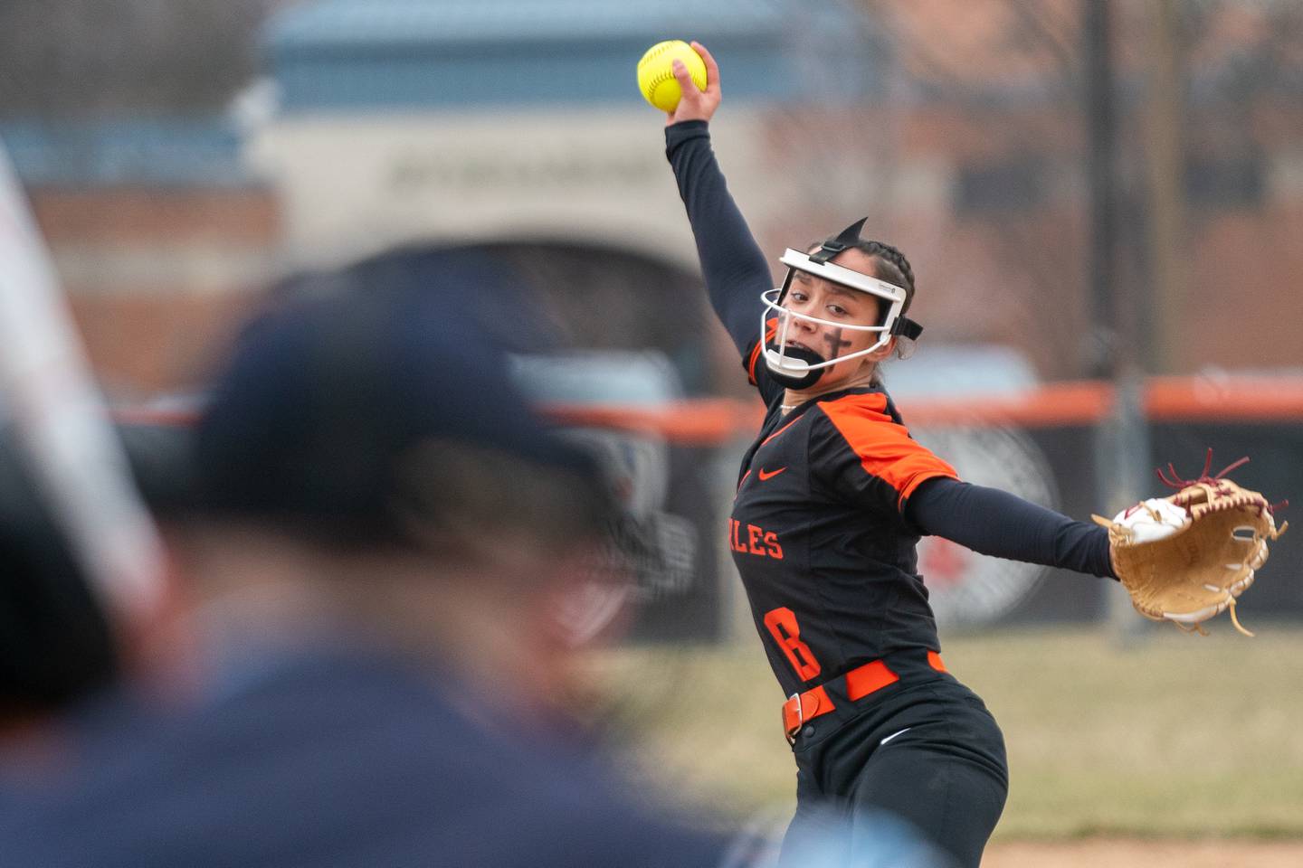 St.Charles East's Grace Hautzinger (8) delivers a pitch against Yorkville during a softball game at St.Charles East High School on Wednesday, Mar 22, 2023.