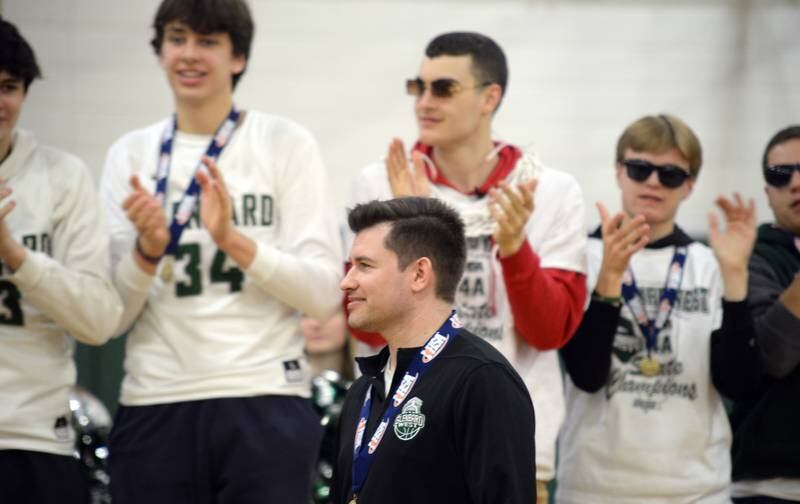 Glenbard West state basketball coach Jason Opoka gets a standing ovation during the pep rally held Sunday March 13, 2022.