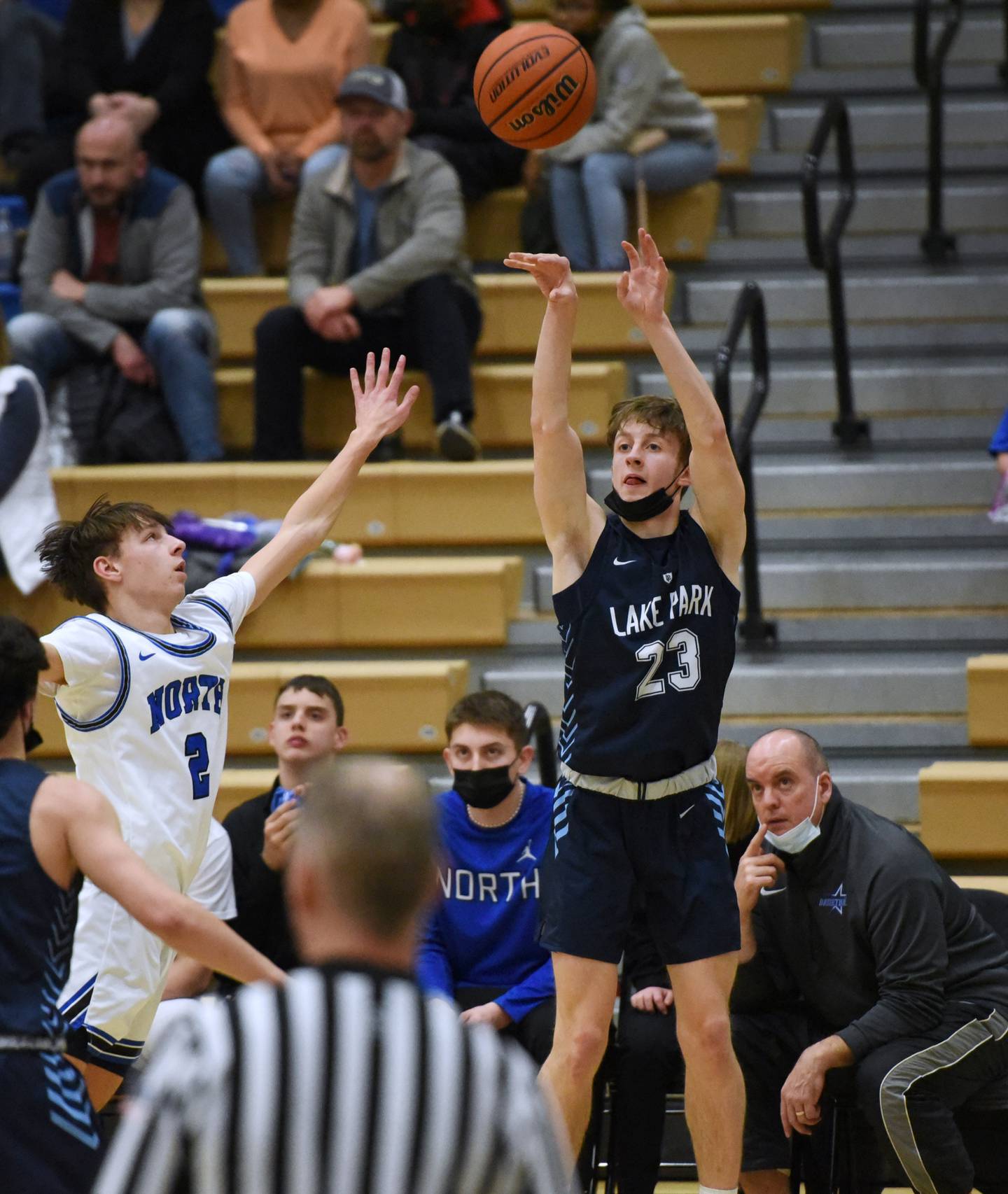 Lake Park's Matthew Zakic (23) takes a shot over St. Charles North's Mason Siegfried during Tuesday's boys basketball game in St. Charles.