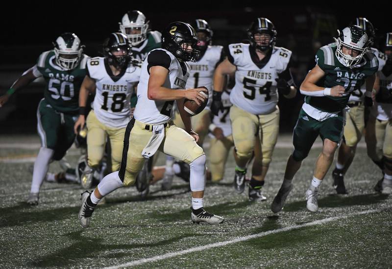 Grayslake North quarterback Mitchell Hughes scrambles against Grayslake Central in a football game at Central High School on Thursday, September 14, 2023.