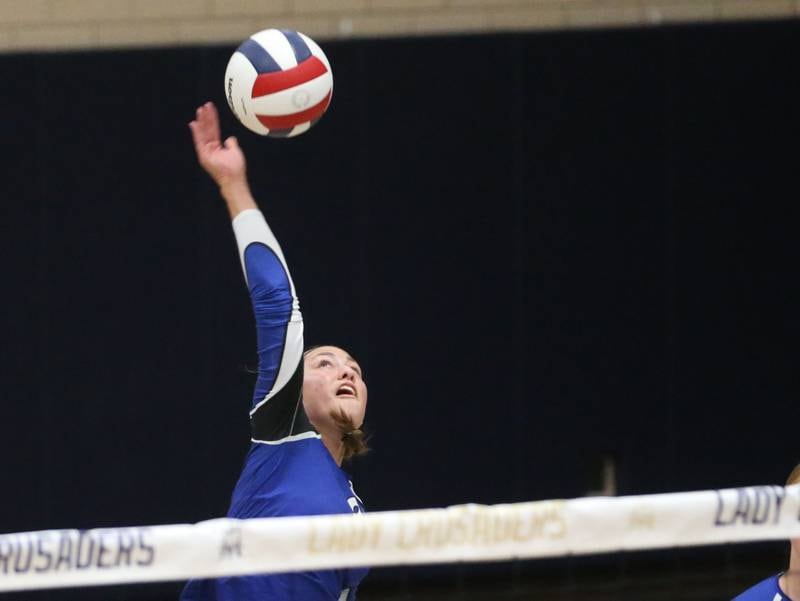 Newark's Heather Buhle reaches up to send the ball back to the Marquette side of the net on Wednesday, Aug. 27, 2025 in Bader Gymnasium.