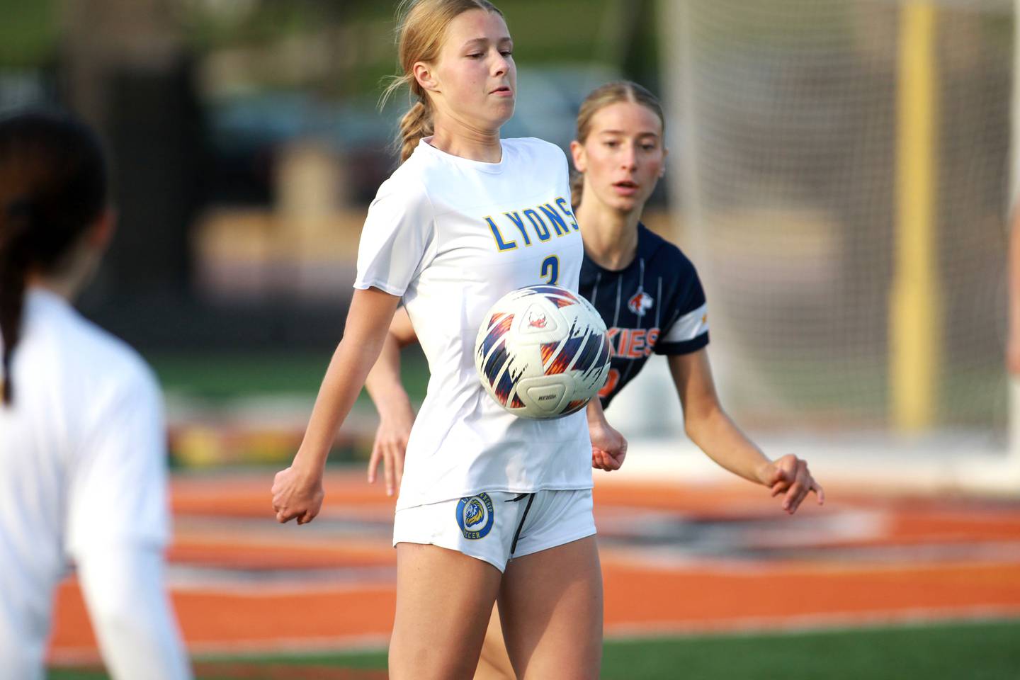 Lyons Township's Grace Chevalier gets contol of the ball during a game against Naperville North on Wednesday, April 16, 2025 in Naperville.