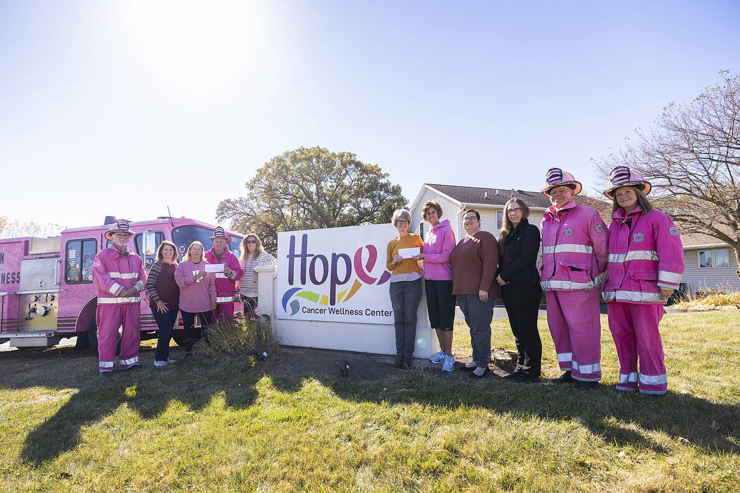 Birdies Fore Boobies, a charity golf outing, donated a pair of checks worth $14,000 to Hope Cancer Wellness Center and Pink Heals of the Sauk Valley on Thursday, Oct. 24. Pictured (from left) are Pink Heals' Barry Collinson; Mimi Boysen, secretary for Birdies Fore Boobies; Monica Hendricks, president of B4B; Pink Heals Director Brian Tribley; Jennifer Lange, B4B committee member; Hope Cancer Wellness Center Director Joan Padilla; Sonja Nicklaus; Tori McDaniel; Adreanna Sommer; and Pink Heals' Harry Vroman and Elizabeth Tribley. Not pictured are B4B committee members Patty Oliver, Julie Helfrich, Jennifer Westphal, Mandy Hinkey and Sheryl Gulbranson.