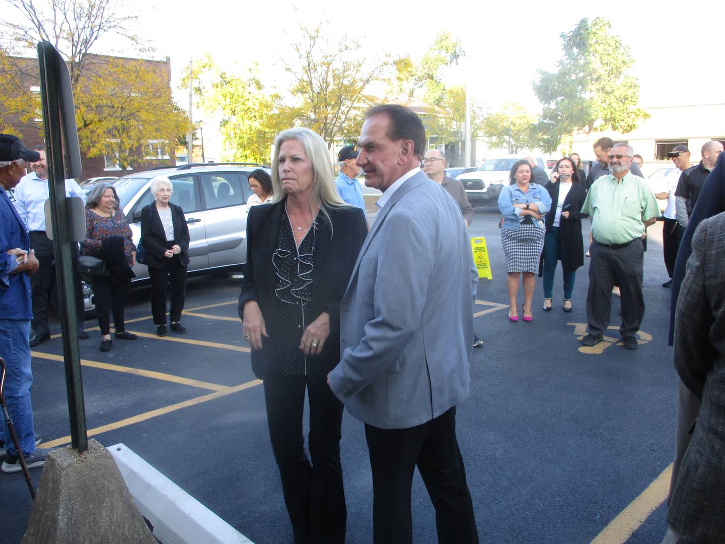 John Bays and wife Jessica Bays, senior vice president at Bays Investment Corp., await the start of a ribbon-cutting ceremony on Thursday for their Bays Tower in downtown Joliet. Oct. 16, 2025