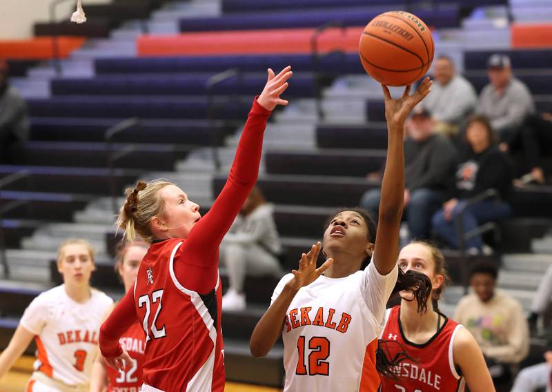 DeKalb’s Brytasi Long shoots over Hinsdale Central's Katherine Skinner during their game Thursday, Feb. 8, 2024, at DeKalb High School.