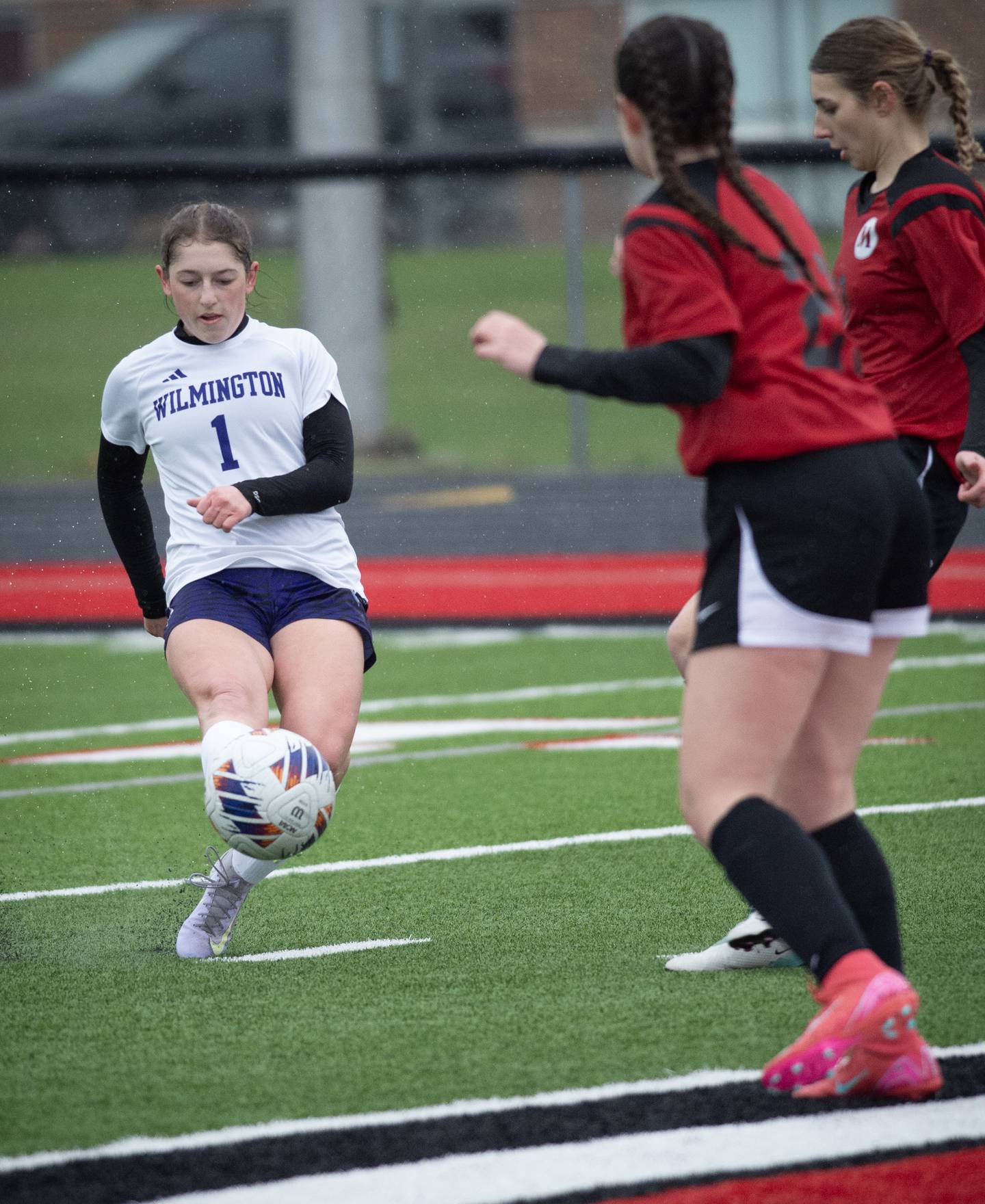 Wilmington's Alaina Clark takes a shot on goal during the game against Momence on April 4, 2025.