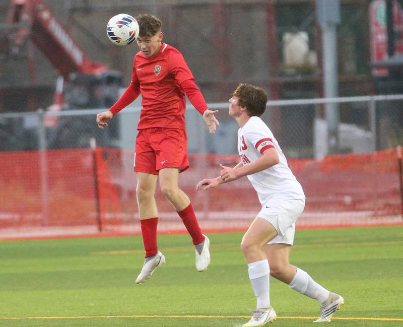 L-P's Jason Curran Jr. puts a header on the ball over Ottawa's Evan Snook on Monday, Sept. 11, 2023 at the L-P Athletic Complex in La Salle.