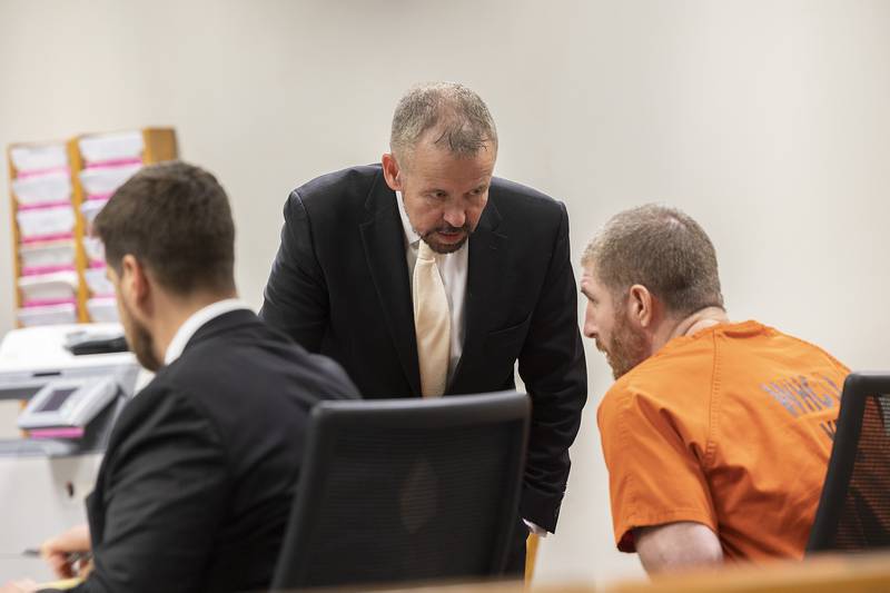 Jim Mertes speaks with his client Kyle Cooper Wednesday, May 14, 2025, in Whiteside County Court.