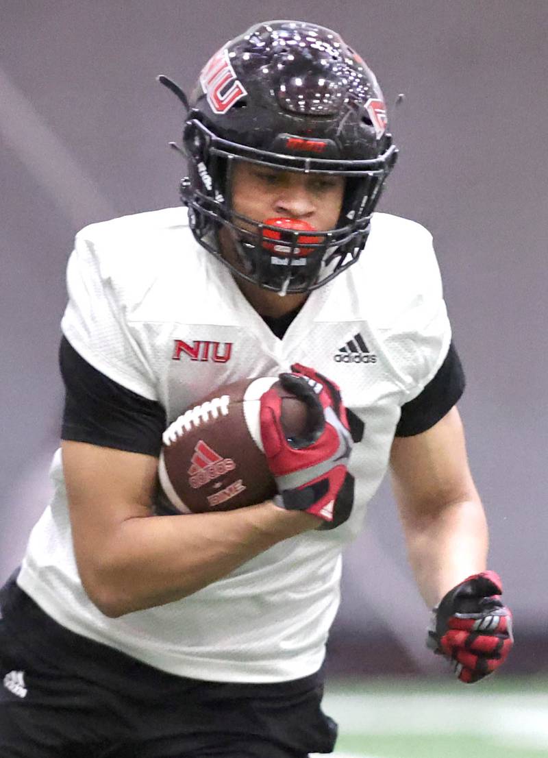 Northern Illinois tight end Chris Stinson carries the ball during their first spring practice Wednesday, March 22, 2023, in the Chessick Practice Center at Northern Illinois University in DeKalb.