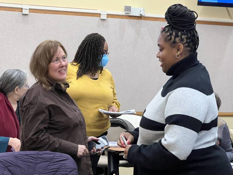 Rookie County Board member Savannah Ilenikhena, a Republican from District 5, talks with board member Laurie Emmer, a Republican from District 4, after an hour long presentation from County Administrator, Brian Gregory on Dec. 14, 2022.