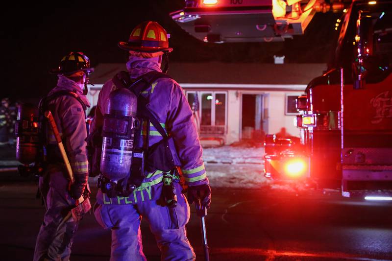Firefighters from the Huntley Fire Protection District respond to a house fire on Thursday, Feb. 8, 2023 on the 10000 block of Church Street.