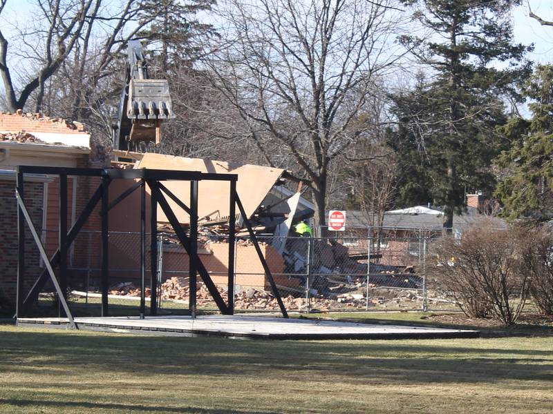 Final parts of the Academy Building in Crystal Lake, built in the 1850s, get demolished on Jan. 13, 2026.