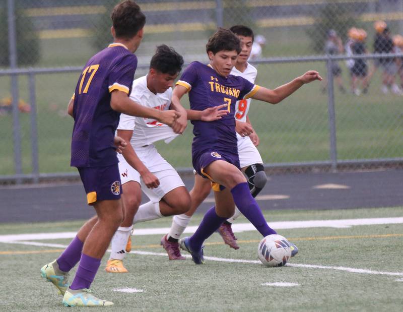Mendota's Isaac Diaz (center) splits Winnebago's defenders Christian Perez and Daniel Guzman to score a goal on Wednesday, Oct. 4, 2023 at Mendota High School.