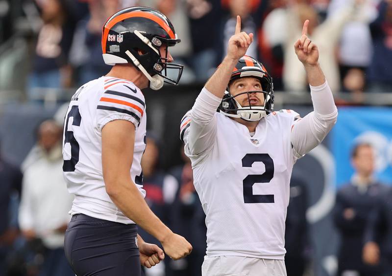 Chicago Bears place kicker Cairo Santos (right) and holder Trenton Gill celebrate the game-winning field goal as time expired giving the Bears a 23-20 win over the Houston Texans Sunday, Sept. 25, 2022, at Soldier Field in Chicago.