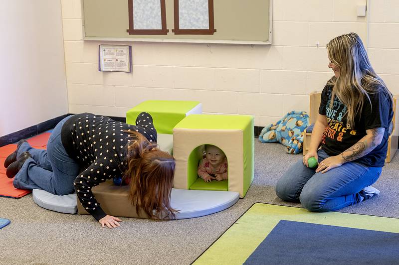 A child plays in an area of the school designed for the youngest learners at the TCOC Early Head Start/Head Start program at Wallace School in Sterling.