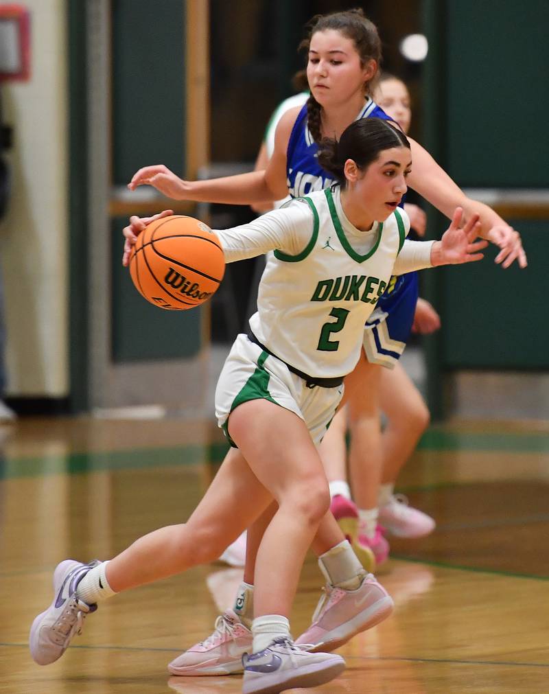 York’s Anna Filosa (2) drives around Lyons Township’s Emma O’Brien. Both reached their 1000 points career mark during a game on February 4, 2025 at York High School in Elmhurst.