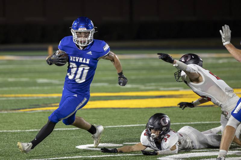 Newman’s Brady Williamson picks up yards against Orion Friday, Sept. 20, 2024, at Roscoe Eades Stadium in Sterling.