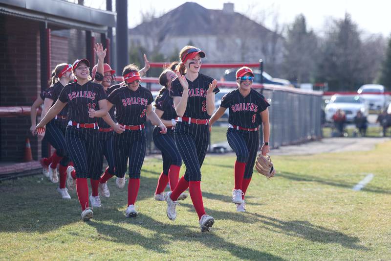 Bradley-Bourbonnais players run to home plate to celebrate a homerun during the Boilermakers' 12-0 victory over Marian Catholic on Tuesday, March 18, 2025.