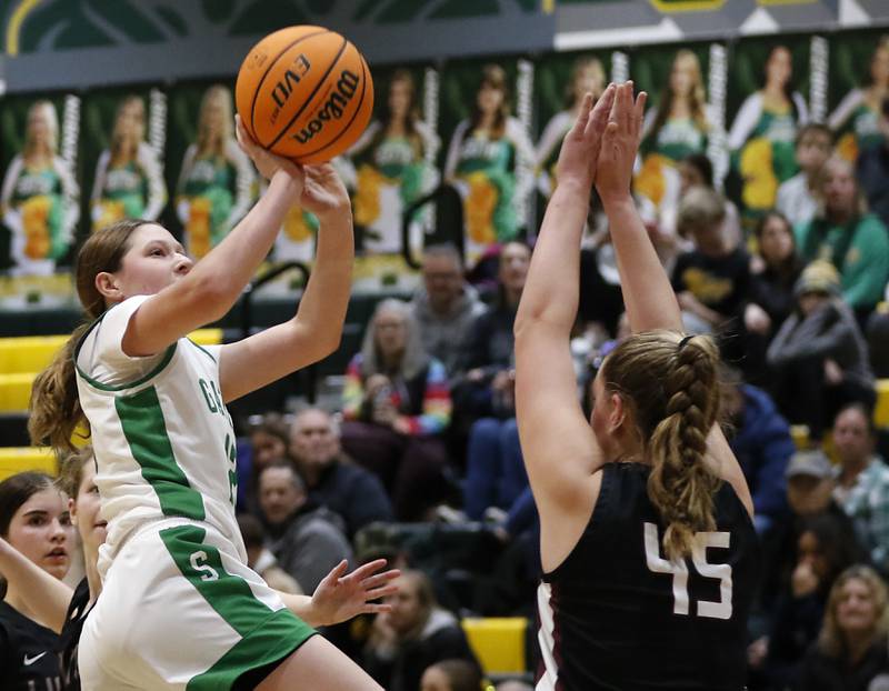 Crystal Lake South's Gaby Dzik shoots the ball over Prairie Ridge's Winter Gallivan during a Fox Valley Conference girls basketball game on Friday, Dec. 13, 2024, at Crystal Lake South High School.