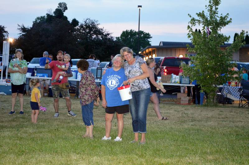 Laura Werner, left, is hugged by Cheryl Newcomer just before Werner was named the Leaf River Grange No. 1812 Citizen of the Year on June 2, 2023, during Leaf River Summer Daze. Newcomer, who was the 2022 Citizen of the Year, and Melinda Colbert nominated Werner for the 2023 award.