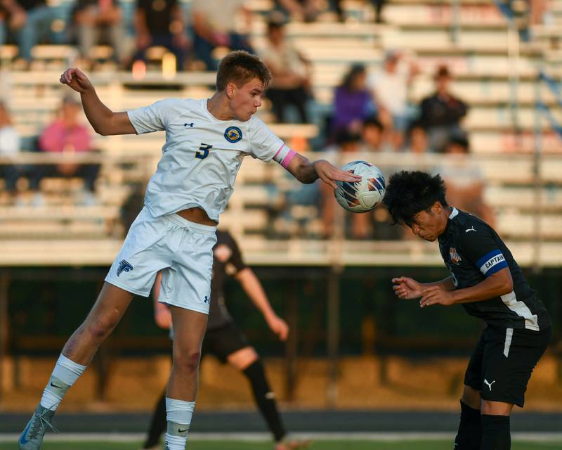 Wheaton North's Ryder Froebe (3) attempts to head the ball and watches as Wheaton Warrenville South Am Za Lian (6) heads the ball during the game on Thursday Sept. 11, 2025, held at Wheaton Warrenville South.