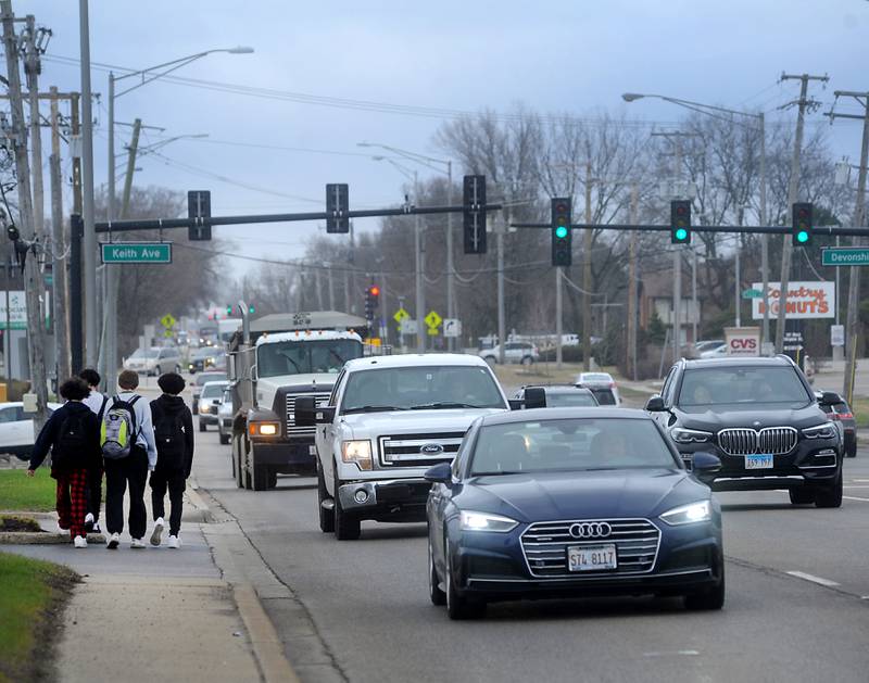 Pedestrian and automobile traffic on U.S. Route 14 on Thursday, April 7, 2022, the  Illinois Department of Transportation plans to begin reconstruction this month on U.S. Route 14 between Pingree Road and Crystal Lake Avenue. The work includes upgrading the existing intersection curb ramps to bring them into compliance with Americans with the Disabilities Act, as well as removing and replacing 1.75 inches of pavement. The cost will project is about $3.5 million, to be paid for by the state.