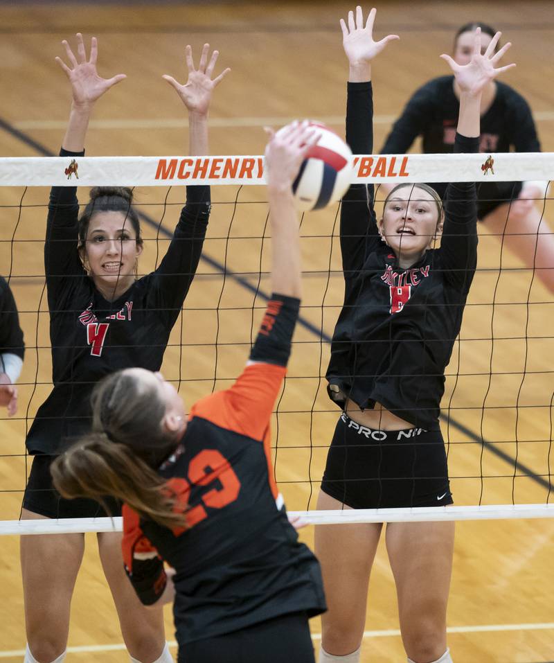 Huntley's Diellza Sejdini, left, and Summer Massow defend against Libertyville's Claire Evans during the Class 4A Sectional girls volleyball final on Thursday, November 7, 2024 at McHenry High School. Ryan Rayburn for Shaw Local