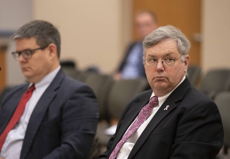 Donald Kountz, right, a candidate for City Council, along with attorney John Dickson, listen during a hearing of the Crystal Lake Municipal Officers Electoral Board for hearing and passing upon of objections to nomination papers for candidates for Mayor and City Council at City Hall on Thursday, December 15, 2022. Ryan Rayburn for Shaw Local