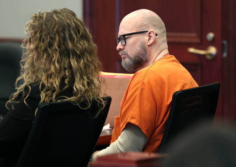 Jonathan D. Hurst, convicted of murdering Sycamore mother and son Patricia and Robert Wilson in 2016, listens to his attorney Chip Criswell Thursday, March 20, 2025, as he lays out his case for a retrial at the DeKalb County Courthouse in Sycamore. Hurst motion for a retrial was denied and he was sentenced to life in prison.