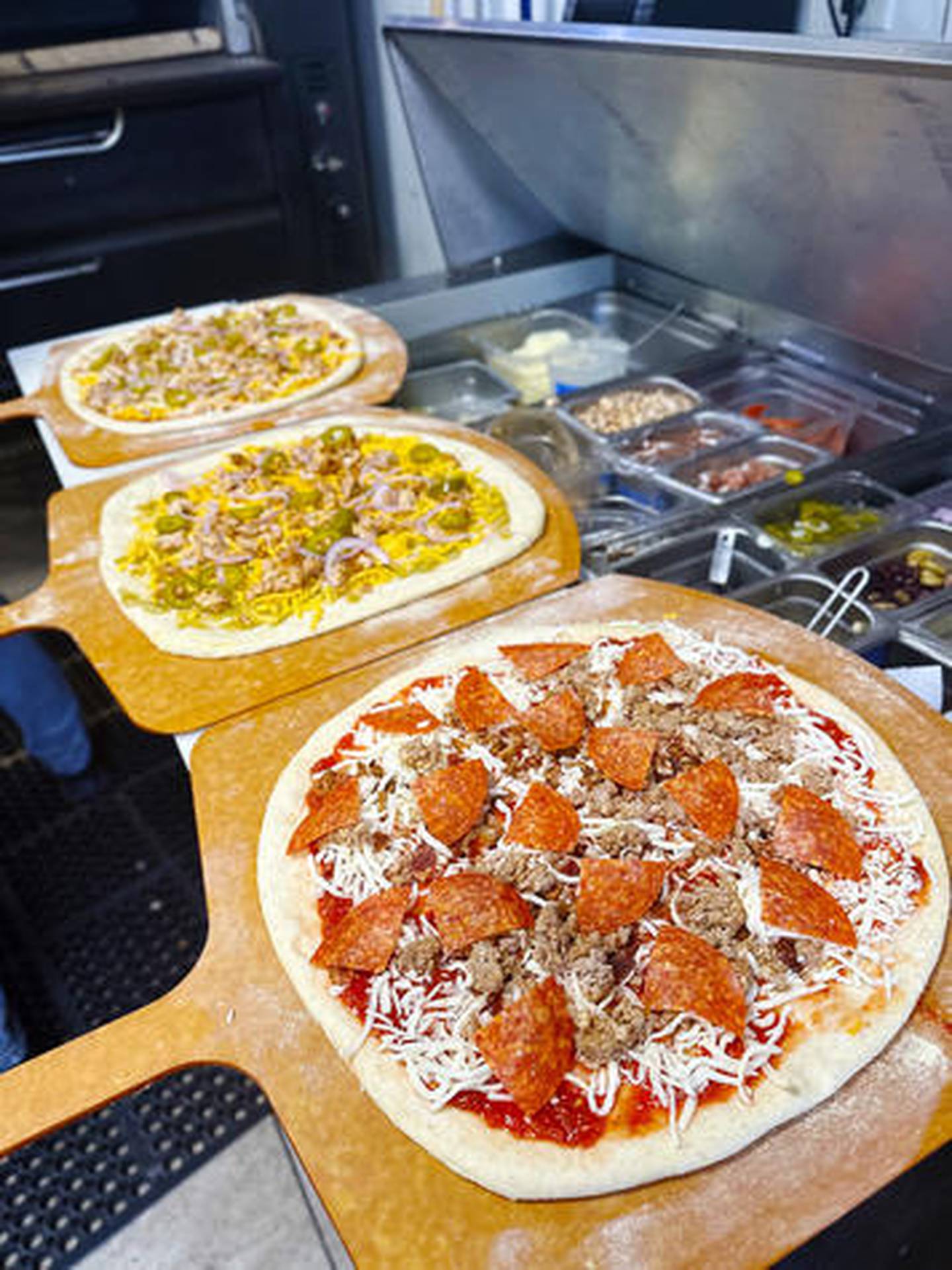 Pizzas in the kitchen of Market Street Pizza in Mount Carroll.
