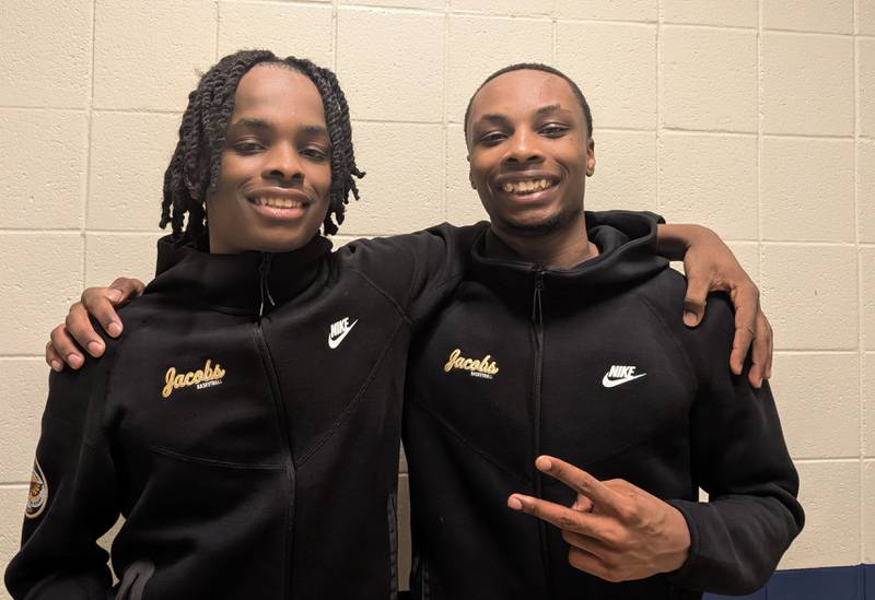 Brothers Malachi (left) and Elijah Bell pose for a picture after combining for 29 points in the Jacobs boys basketball team's 45-42 win over Buffalo Grove in the Lakes Thanksgiving Tournament on Tuesday, Nov. 25, 2025, in Lake Villa.