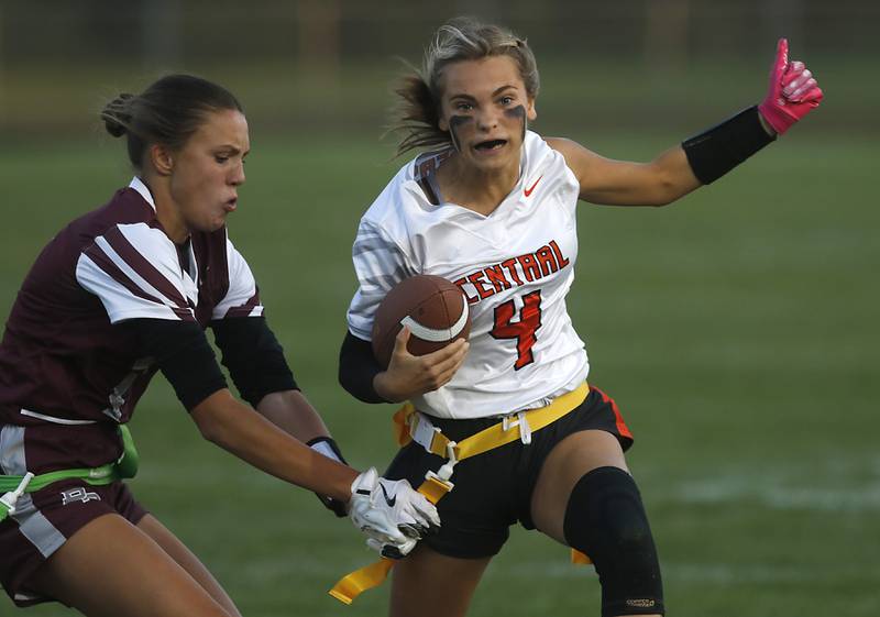 Prairie Ridge’s Lila Stewart grabs Crystal Lake Central's Ella Mueller tries to grab her flag during a girls flag football game on Thursday, Sept. 4, 2025, at Prairie Ridge High School in Crystal Lake.