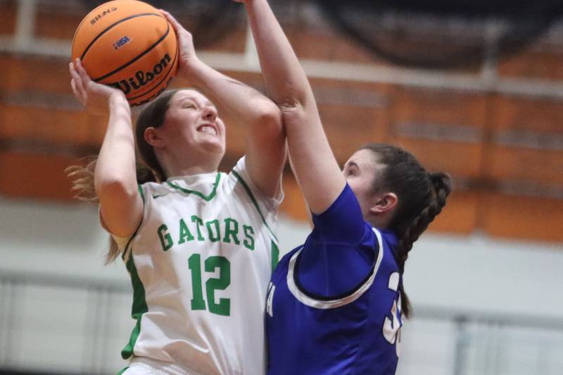 Crystal Lake South’s Gaby Dzik, left, shoots as Geneva’s Keira McCann defends in girls IHSA Class 3A Sectional Championship basketball on Thursday, Feb. 26, 2026, at Crystal Lake Central High School in Crystal Lake.
