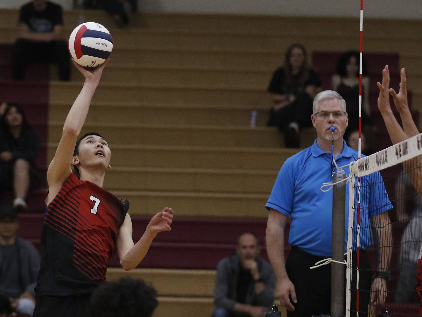 Huntley’s Barsbek Ulanbekuulu tips the ball over the net during a nonconference boys volleyball match against Grant on Thursday, May 21, 2026, at Huntley High School.