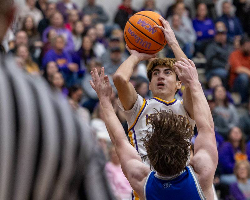Mendota's Johan Cortez (4) shoots midrange shot over Ashton Miner (0) of Newman Central Catholic on Friday, January 30, 2026 at Mendota High School in Mendota.