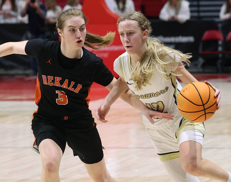 Sycamore's Sadie Lang tries to drive by DeKalb's Olivia Schermerhorn during their game Friday, Jan. 31, 2025, in the FNBO Challenge in the Convocation Center at Northern Illinois University in DeKalb.
