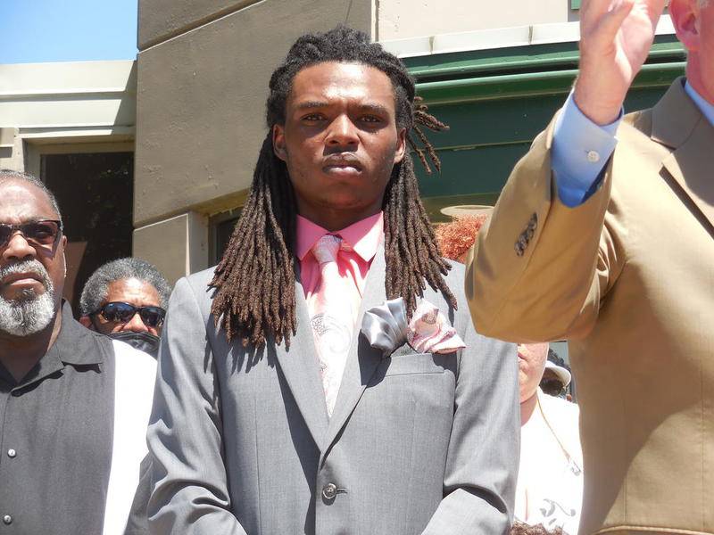 Victor Williams (center) at a press conference outside Joliet City Hall Monday. Williams was arrested after he was confronted and grabbed by Joliet Mayor Bob O'Dekirk at a Black Lives Matter demonstration May 31.