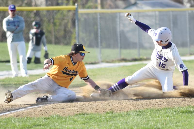 Herscher's Brock Berns, left, applies a tag on Wilmington's Declan Moran during a game at Wilmington Tuesday, April 7, 2026.