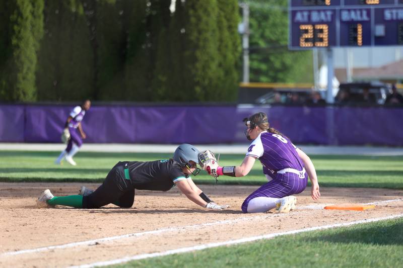 Manteno's Mady Dye puts the tag on Seneca's Taylor Schaefer at first base for an out during Manteno's 11-1 loss to Seneca on Friday, May 8, 2026.