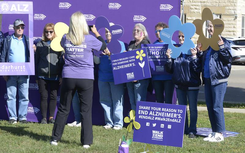 Participants that took part in the 2025 Walk to End Alzheimer’s on Saturday, pose for a photo at the selfie station prior to the walk in Ottawa.