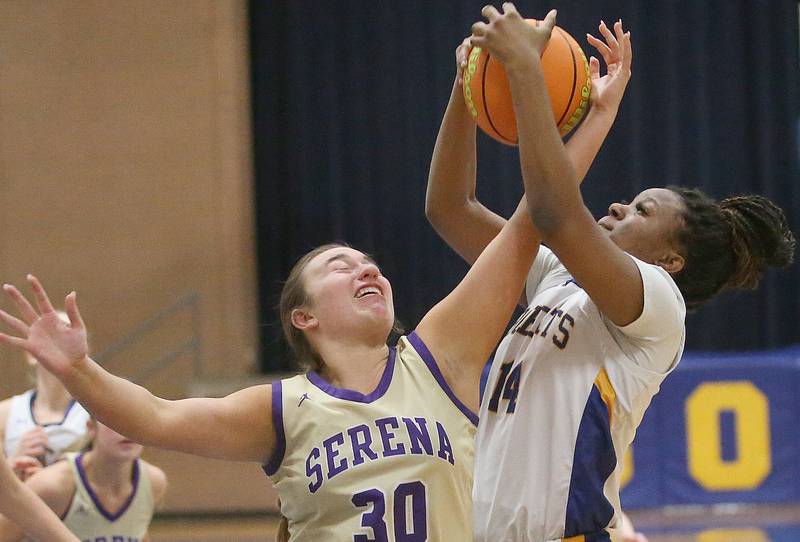 Somonauk/Leland's Leah Norris pulls in a rebound over Serena's Maddie Glade on Monday, Feb. 10, 2025 at Somonauk High School.
