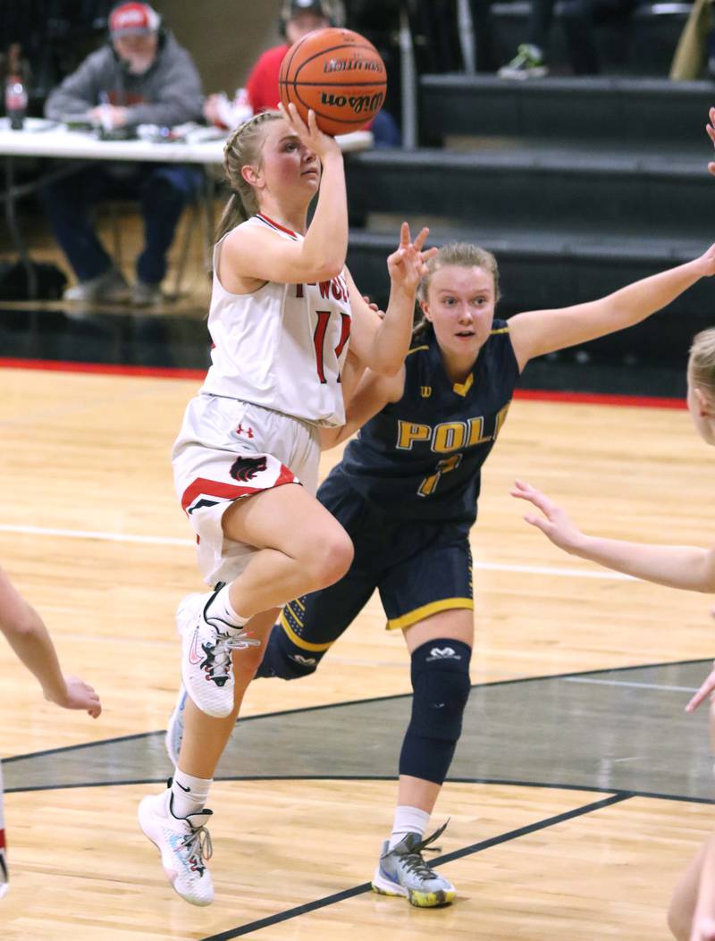 Indian Creek's Madison Bogle scores on a shot in the lane in front of Polo's Kadence Sheaffer during their Class 1A regional game Tuesday, Feb. 15, 2022, at Indian Creek High School in Shabbona.
