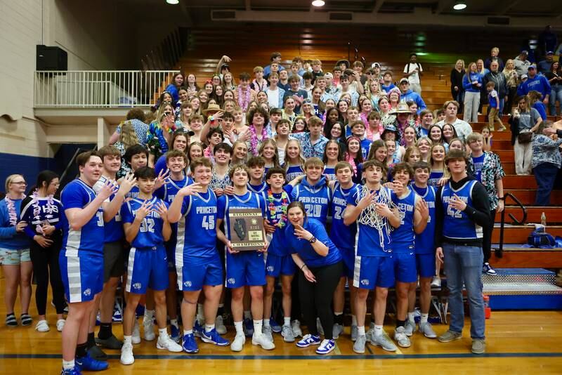 The Princeton Tigers celebrate their 59-53 victory over Seneca in Friday's regional championship with their student body fan section.