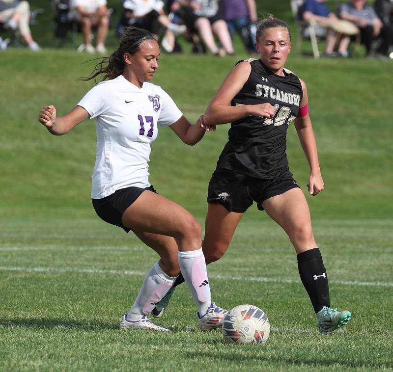Dixon’s Kamille Prather tries to get by Sycamore's Taylor Zemanek during their game Thursday May 15, 2025, at Sycamore High School.