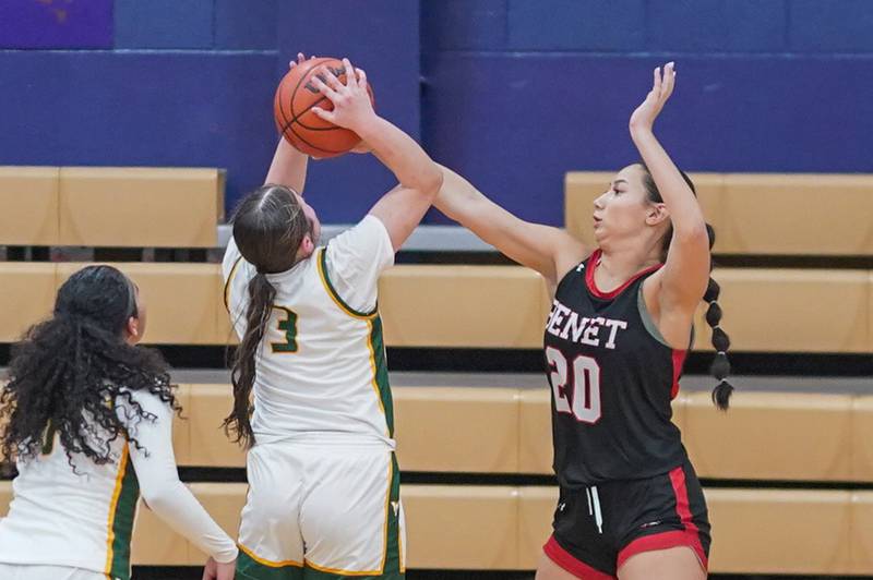 Benet’s Emma Briggs (20) blocks a shot by Waubonsie Valley's Maya Cobb (3) during a Class 4A Oswego Sectional final basketball game at Oswego High School on Thursday, Feb 22, 2024.