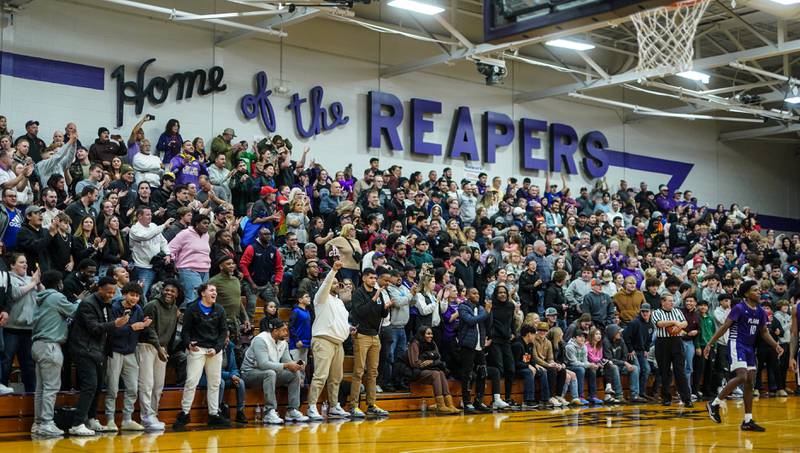 Plano fans give a standing ovation to their team with seconds left in the forth quarter of play against Kaneland during a championship game of the 60th annual Plano Christmas Classic Basketball Tournament at Plano High School on Saturday, Dec 30, 2023.