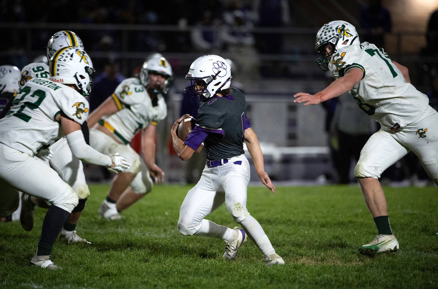 Wilmington's Billy Moore, center, carries the ball on a play while trying to evade Coal City's Cade Poyner, right, and Noah Houston, left, in a game on Friday, October 24, 2025.