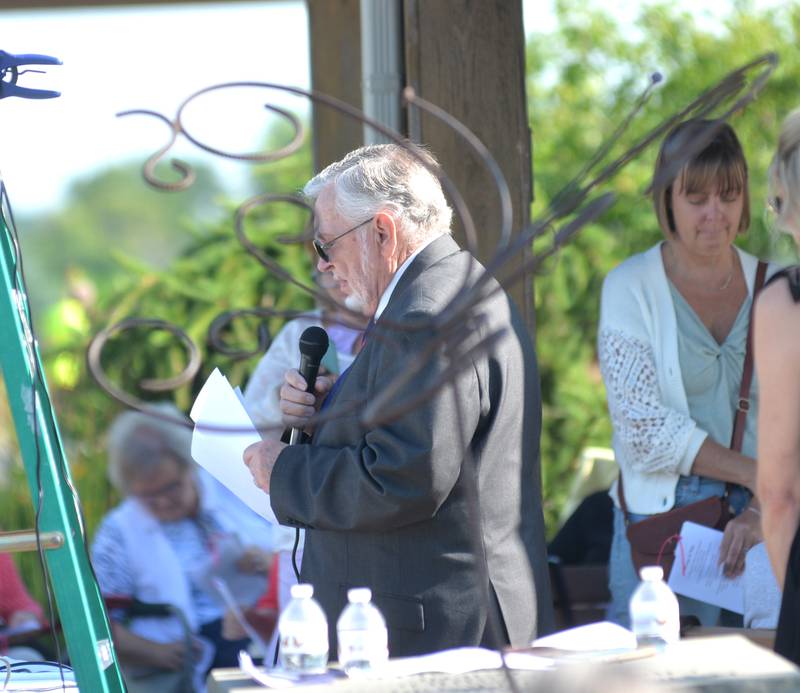 Serenity Home & Hospice Chaplain Rev. Dave Rogula says a prayer at the memorial butterfly release on Saturday, July 8, 2023, in Oregon.