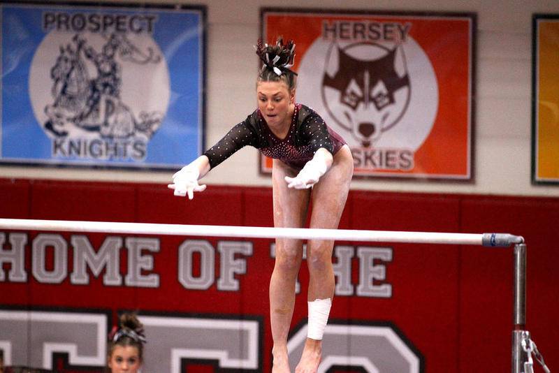 Prairie Ridge co-op's Gabby Riley competes on the uneven bars during the IHSA Girls Gymnastics State Meet on Friday at Palatine. Riley, a freshman, won the all-around title.