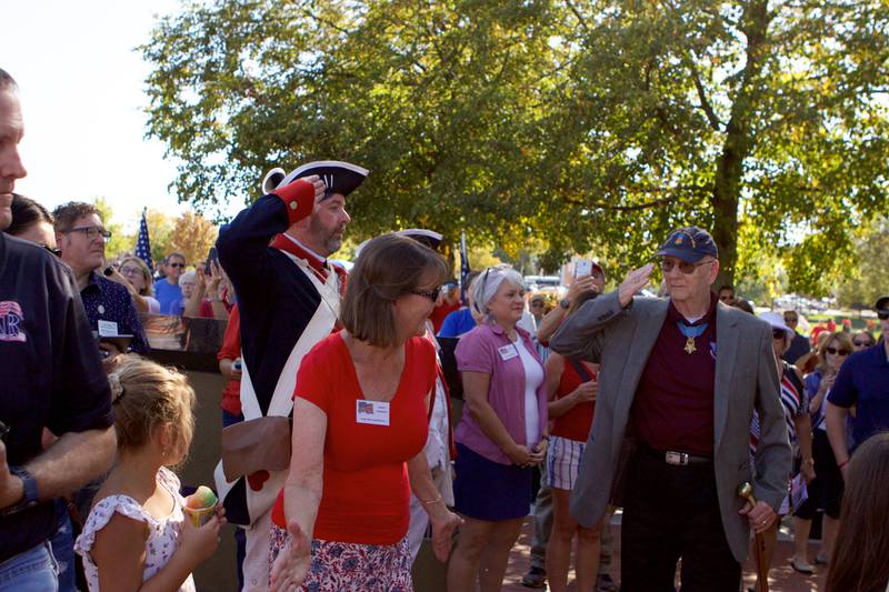 National Medal of Honor Veteran Allen J Lynch walks to the monument at the Flag Day Monument opening ceremony's at Patriot's Park on Sunday, Oct 1,2023 in Batavia.